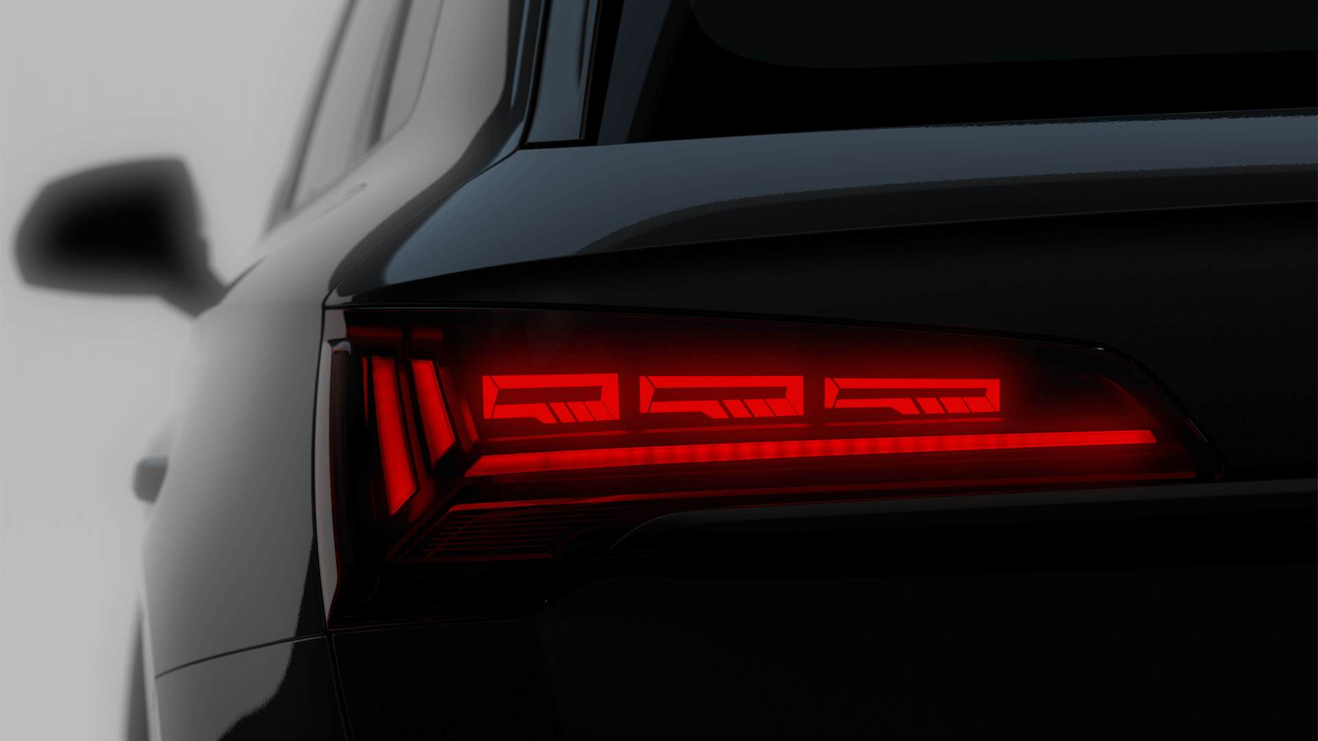 Foto de la firma lumínica de los faros OLED de un Audi Q5.